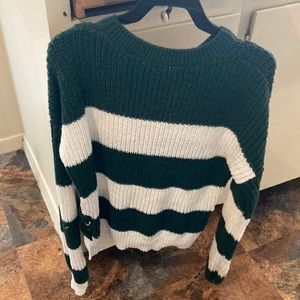 It’s a green and white shirt perfect with some Jeans a little bit see-through